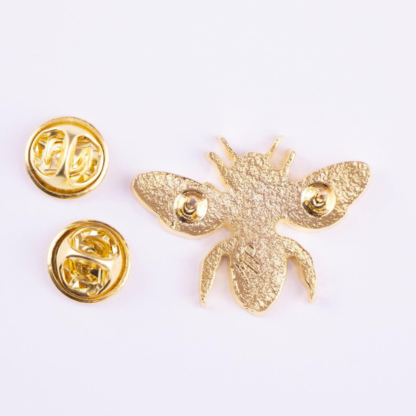 atras pin abeja