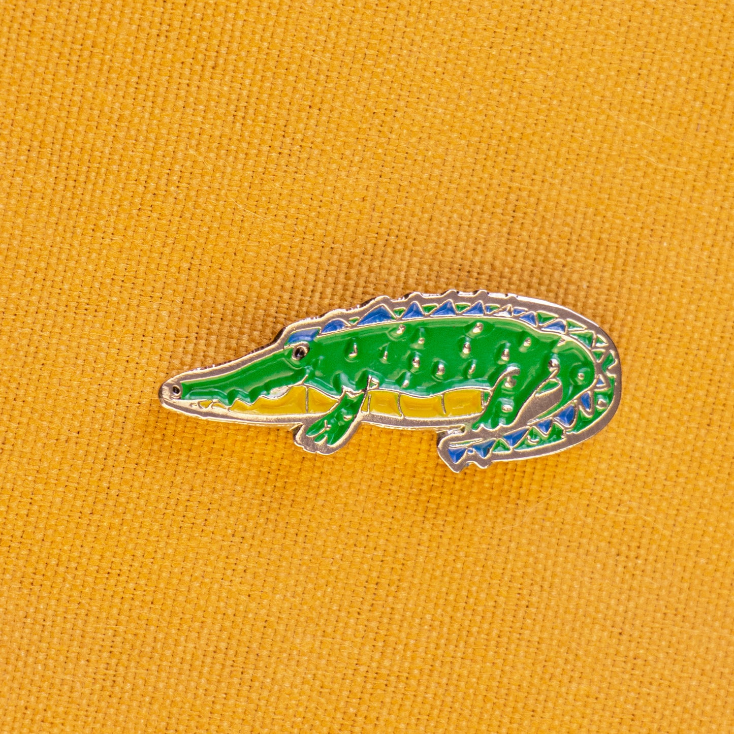 pin cocodrilo tela