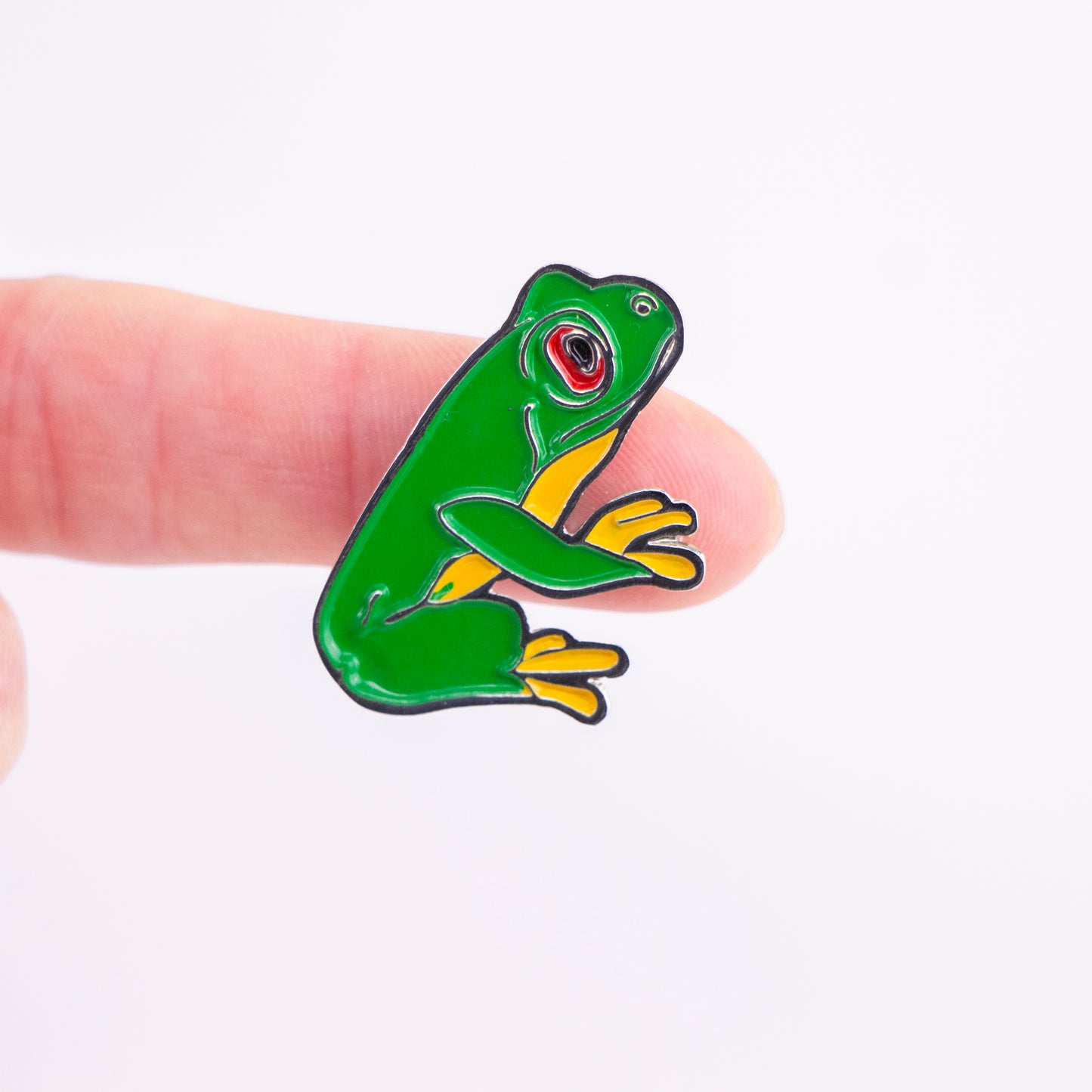 Pin de rana en mano